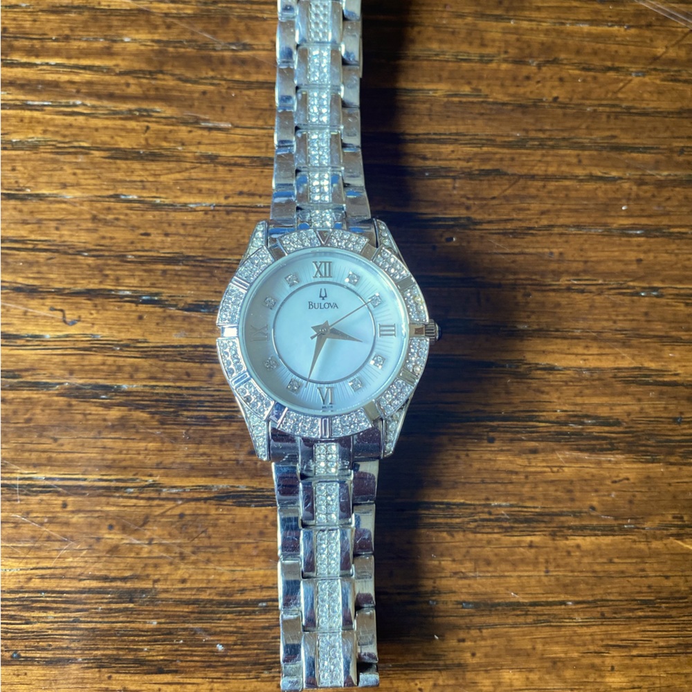 Silver bulova watch with crystals